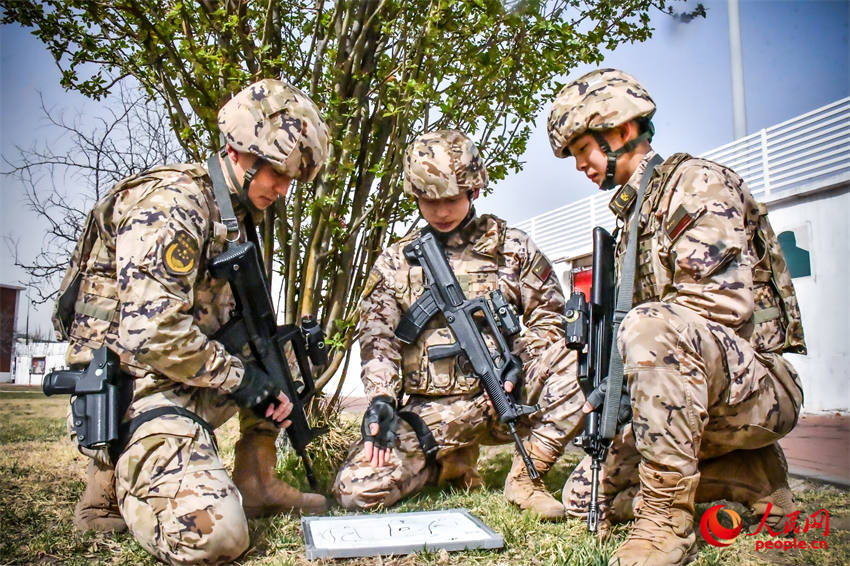  Special operations team members conduct operational terrain analysis.